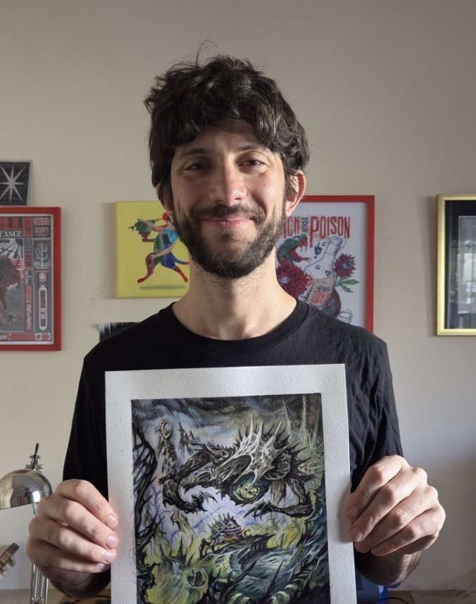 Cacho Rubione holding one of his original Magic paintings